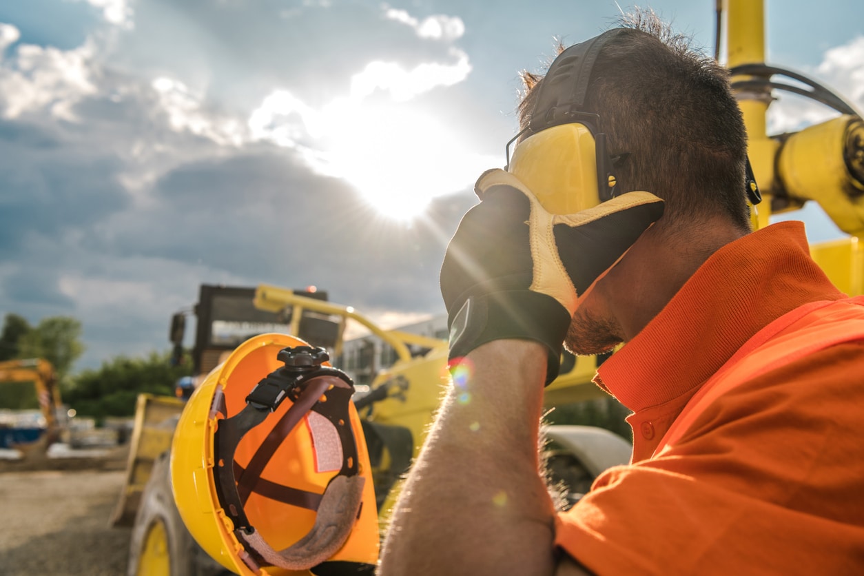 Construction worker wears hearing protection